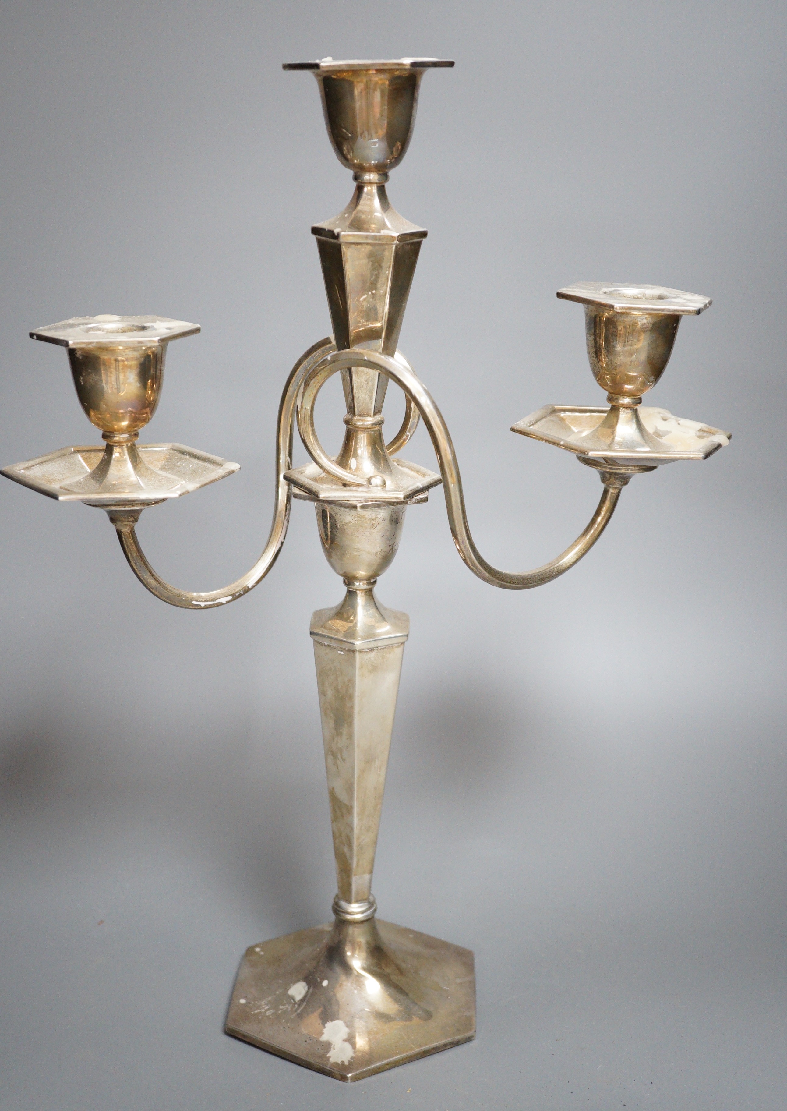 A George V silver two branch, three light candelabrum, marks rubbed, height 39cm, weighted.